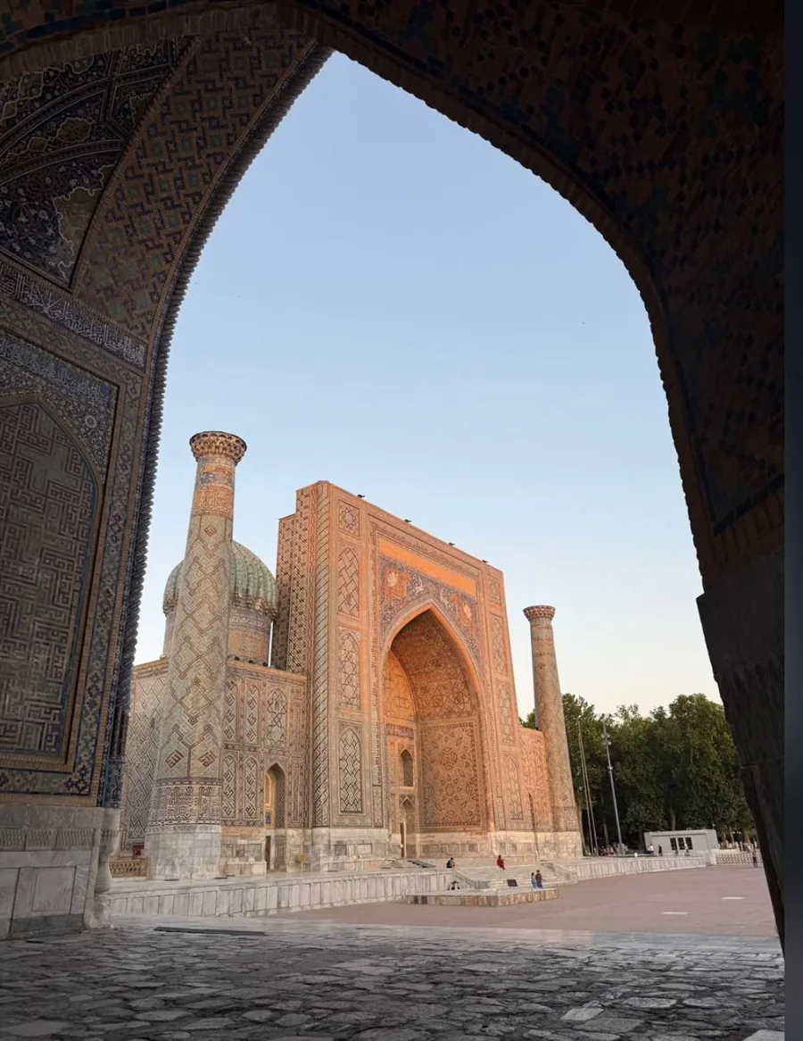 Registan architecture framed by a shaded pointed arch