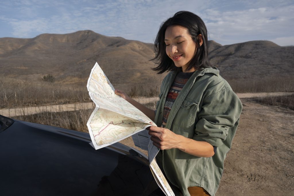 people-getting-ready-winter-camping (2) - Silk Road Elite - Silk Road Elite Woman preparing for winter travel in a mountain landscape