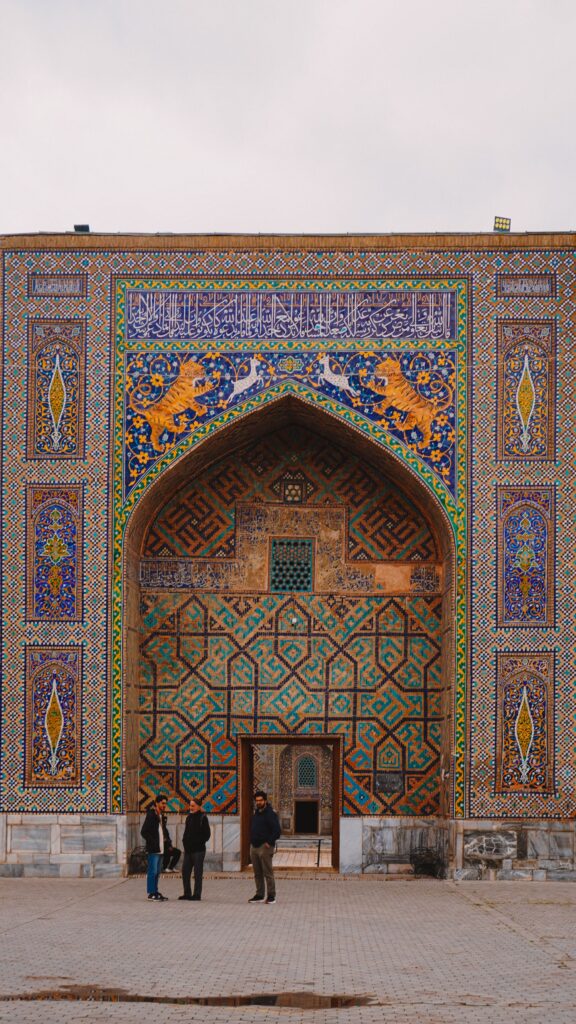 Colorful mosaic arch framing the entrance to a historic monument