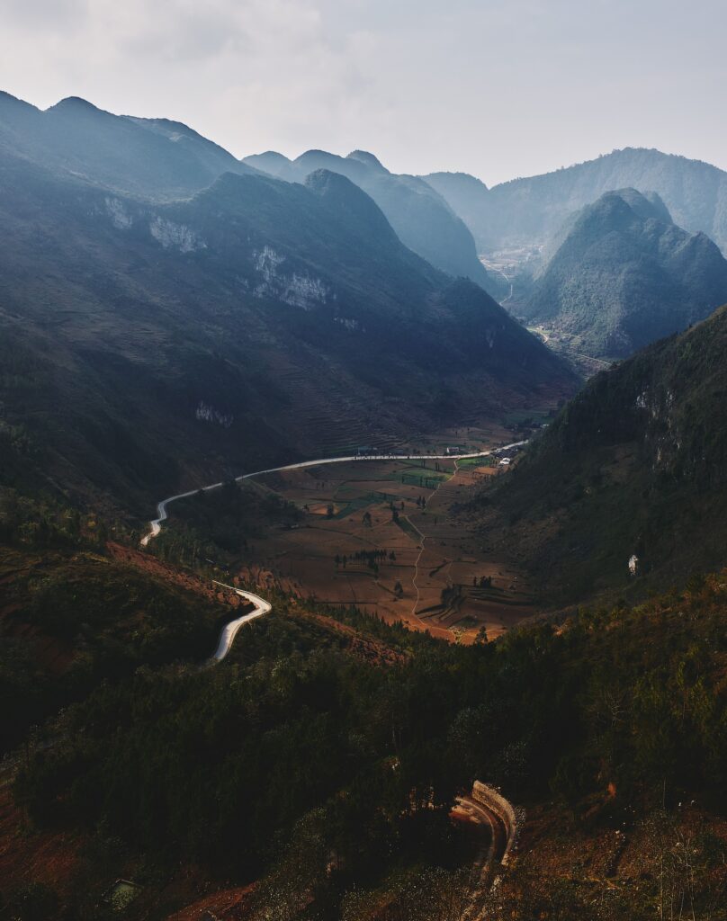 Winding road through a steep mountain valley