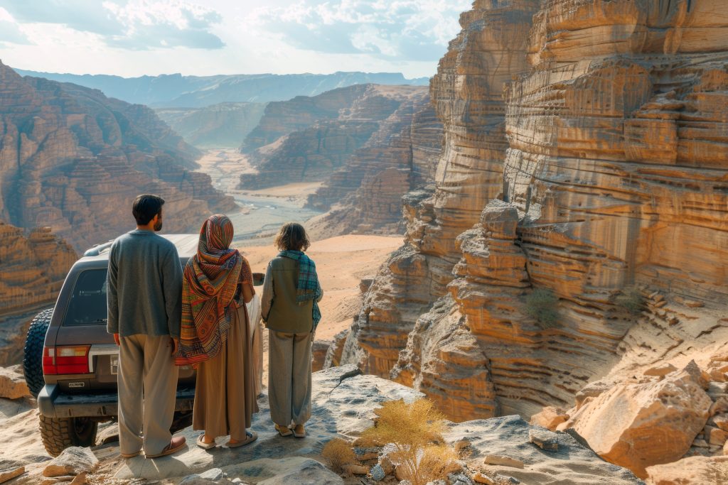 Travelers overlooking a dramatic canyon landscape
