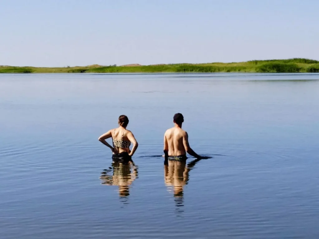 Travelers enjoying Aydarkul Lake, Uzbekistan