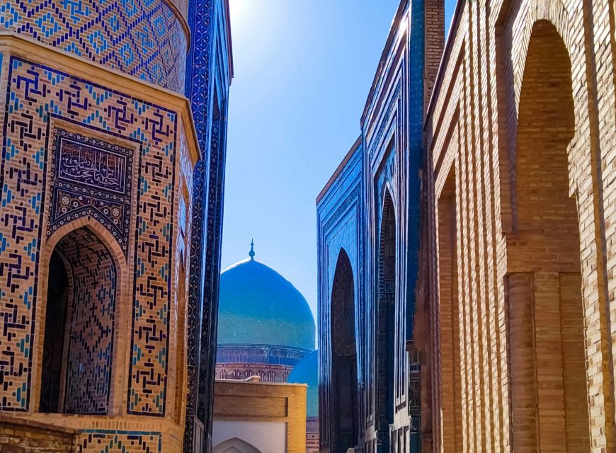 Narrow passage between intricately tiled historic buildings