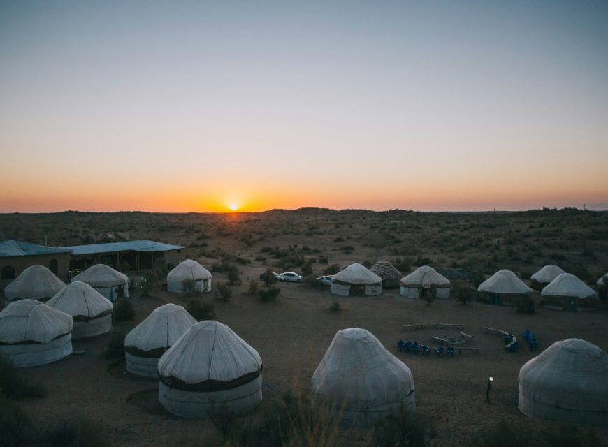 Traditional white yurts at sunset