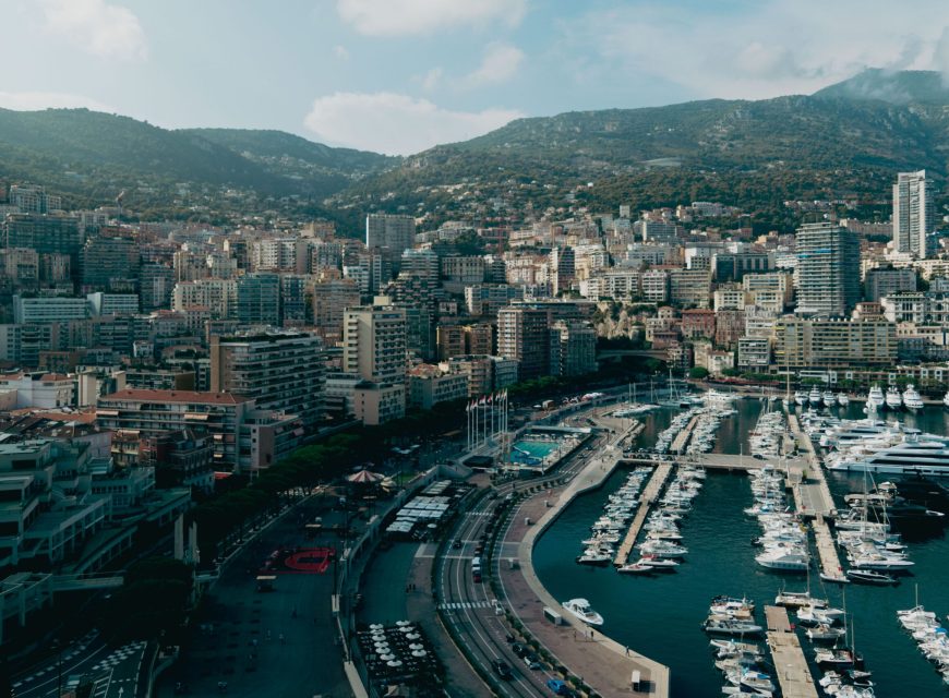 Aerial view of a city surrounded by mountains