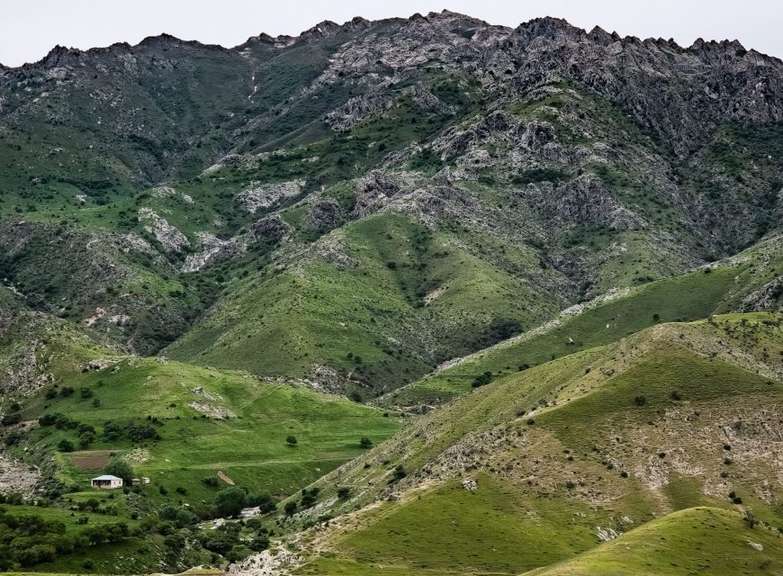 Green mountain ridges covered with rocky vegetation
