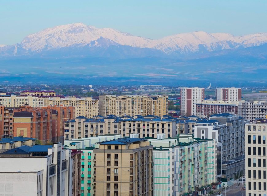 Tashkent skyline with snow-capped mountains in the distance