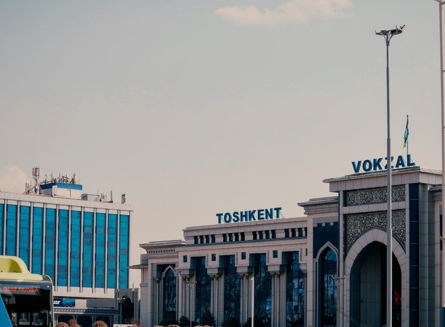 Airport terminal building beneath a hazy sky